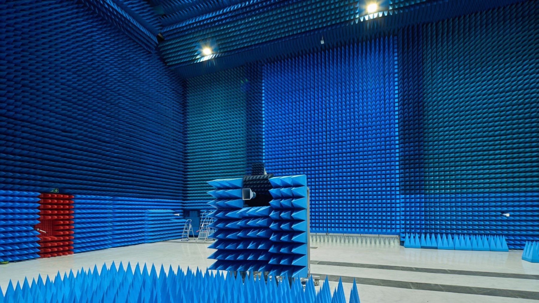 Blue-lined electromagnetic compatibility test chamber at the National Satellite Test Facility, powered by Thomas Halliwell