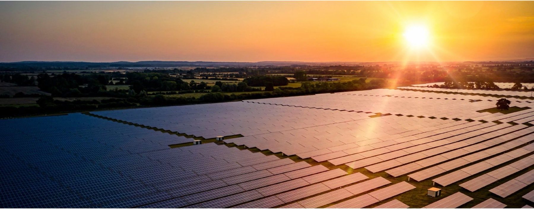 Large solar PV array at sunset